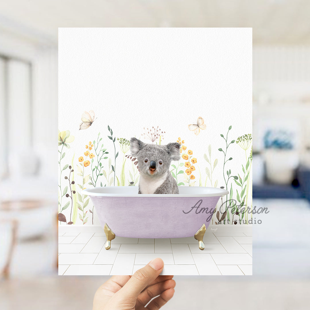 a person holding a card with a picture of a koala in a bathtub