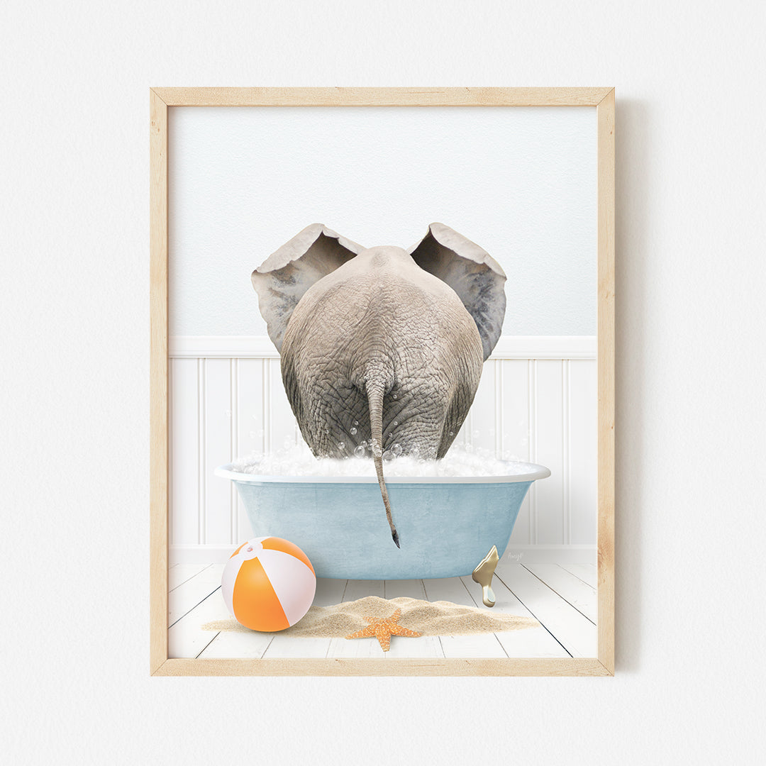 a picture of an elephant taking a bath