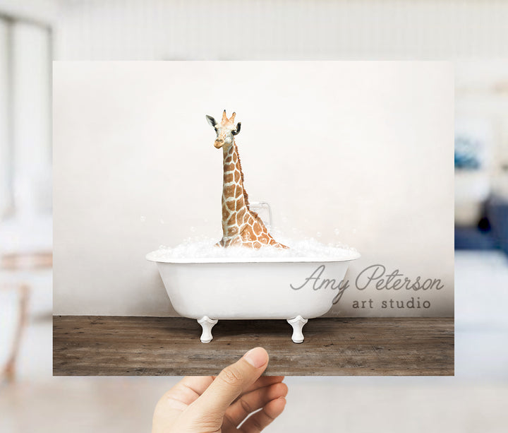 a giraffe is sitting in a bath tub