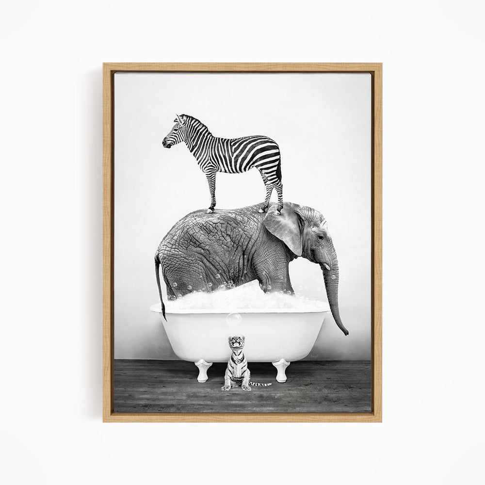 A zebra stands on top of an elephant in a bathtub, with a small tiger sitting in the tub below.