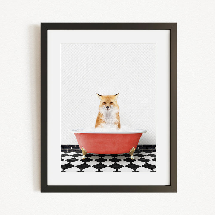 A red bathtub filled with water, with a fox sitting inside and looking directly at the camera.