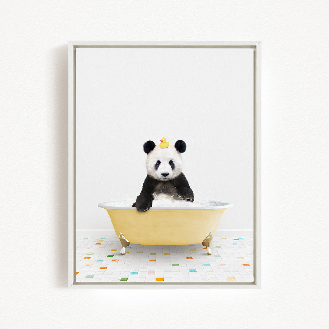 A panda bear sitting in a yellow bathtub filled with bubbles, with a rubber duck floating on the water.