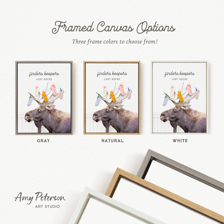 The image is a framed canvas with three different frame colors: gray, natural, and white. The canvas features a moose with antlers, and the text "framed Canvas Options" is displayed above the canvas.