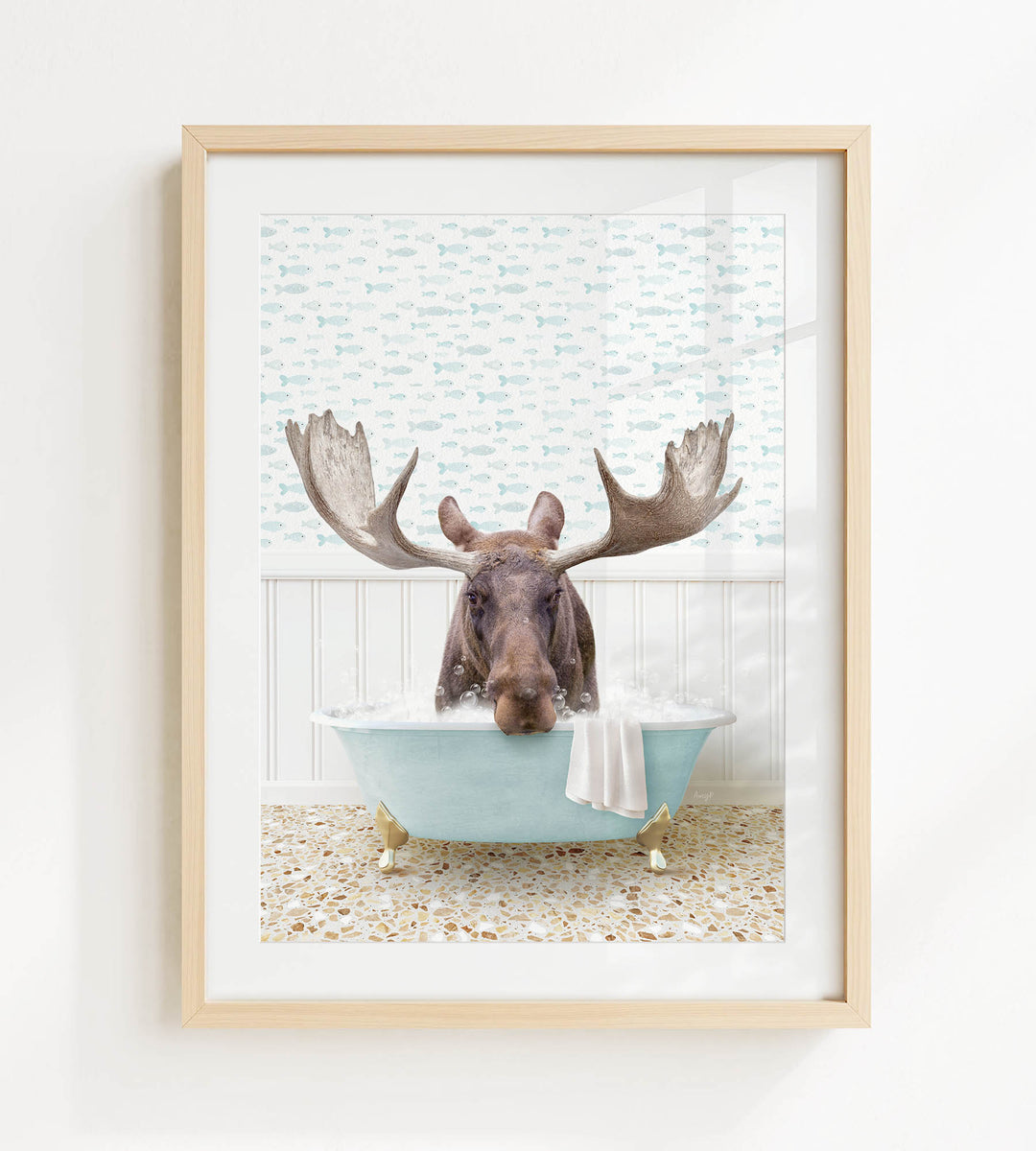 A moose with large antlers is sitting in a blue bathtub filled with bubbles, creating a whimsical and playful scene.
