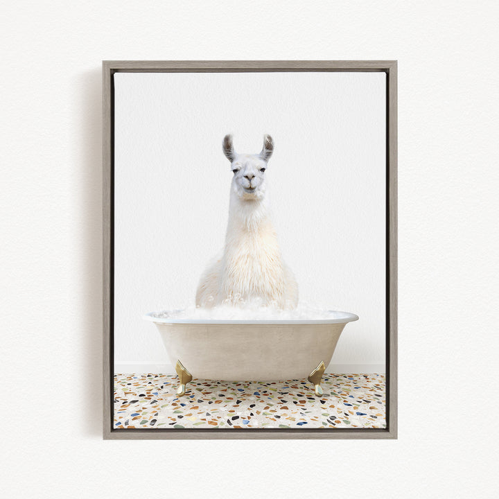 A white llama sitting in a white bathtub filled with water, creating a whimsical and playful scene.