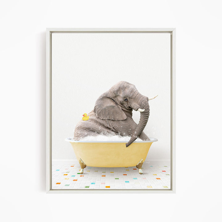 A gray elephant is sitting in a yellow bathtub, with a yellow rubber duck floating on its back.