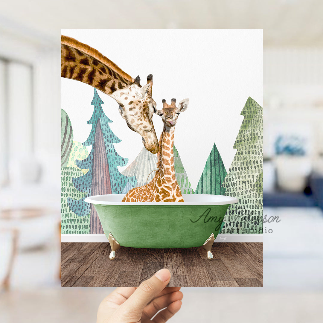 a hand holding up a card with two giraffes in a bathtub