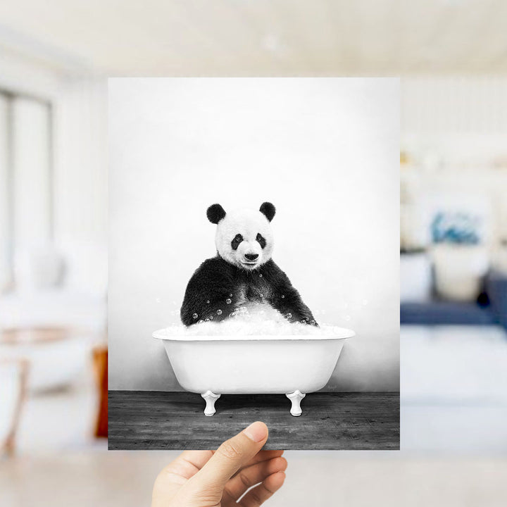 A panda bear sitting in a bathtub filled with water, as if enjoying a relaxing bath.