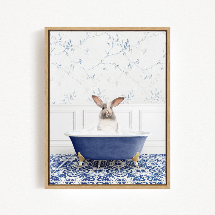 A white rabbit sitting in a blue bathtub filled with water, surrounded by a blue and white patterned tile floor.