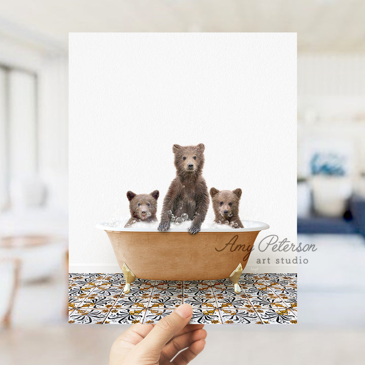 a person holding a card with three bears in a bathtub