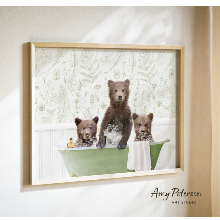 A framed print depicting three bears sitting in a bathtub, with one bear sitting in the center and the other two bears sitting on either side.