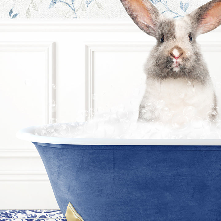 a rabbit is sitting in a bathtub with foam