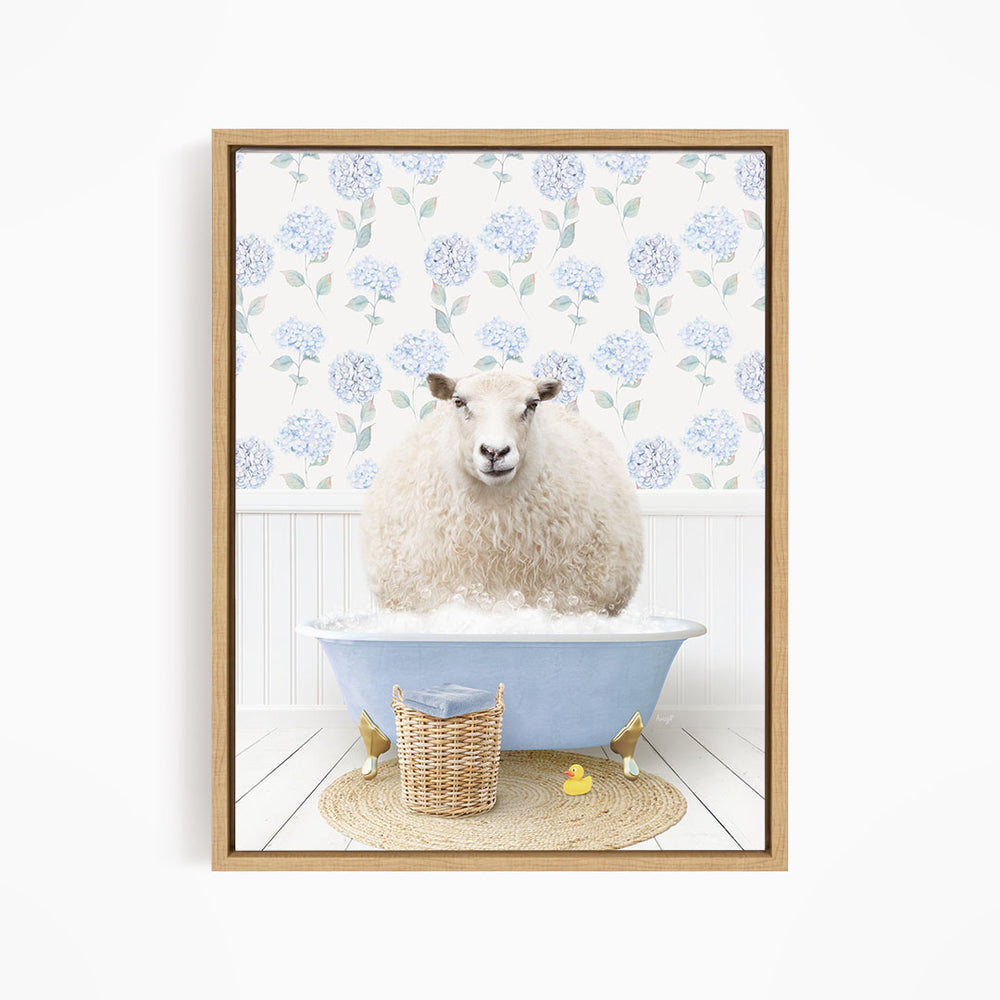 A fluffy white sheep sits in a blue bathtub filled with bubbles, surrounded by a wicker basket and yellow rubber ducks.
