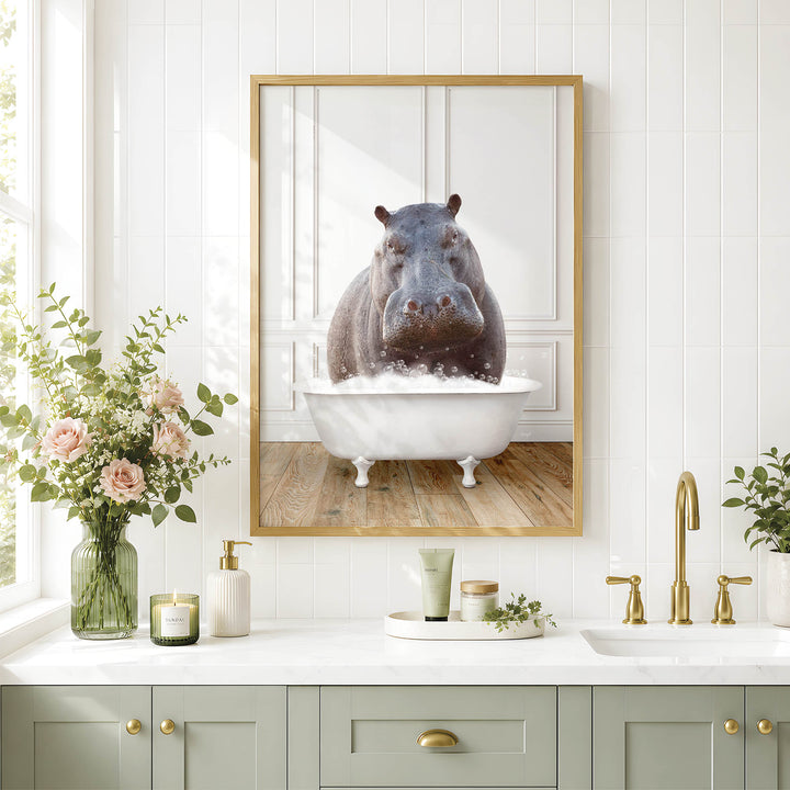 A framed image of a hippopotamus sitting in a bathtub, surrounded by a vase of flowers, candles, and other bathroom accessories.
