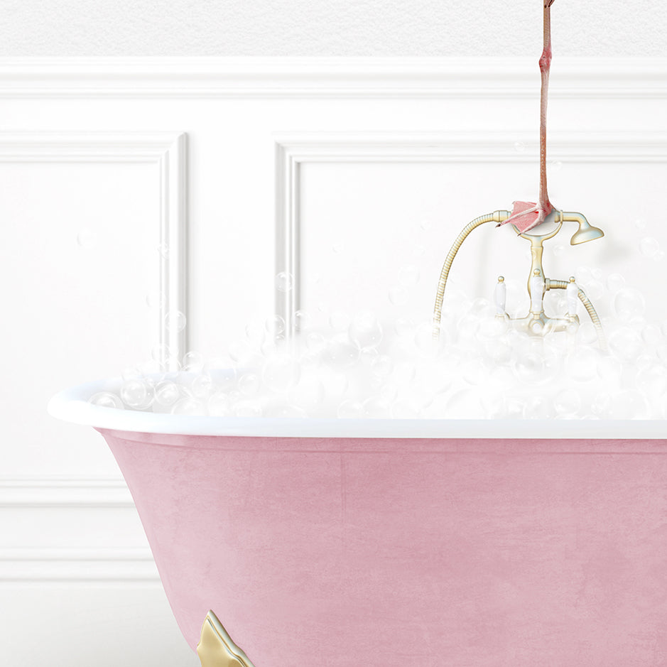 a pink bath tub filled with white foam