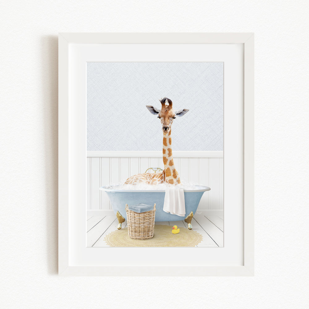 A giraffe standing in a blue bathtub filled with bubbles, surrounded by a yellow rubber duck and a basket.