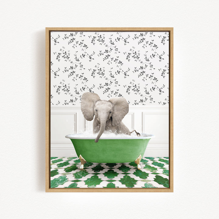 A gray elephant is sitting in a green bathtub filled with water, surrounded by a patterned wall and green and white tiles on the floor.
