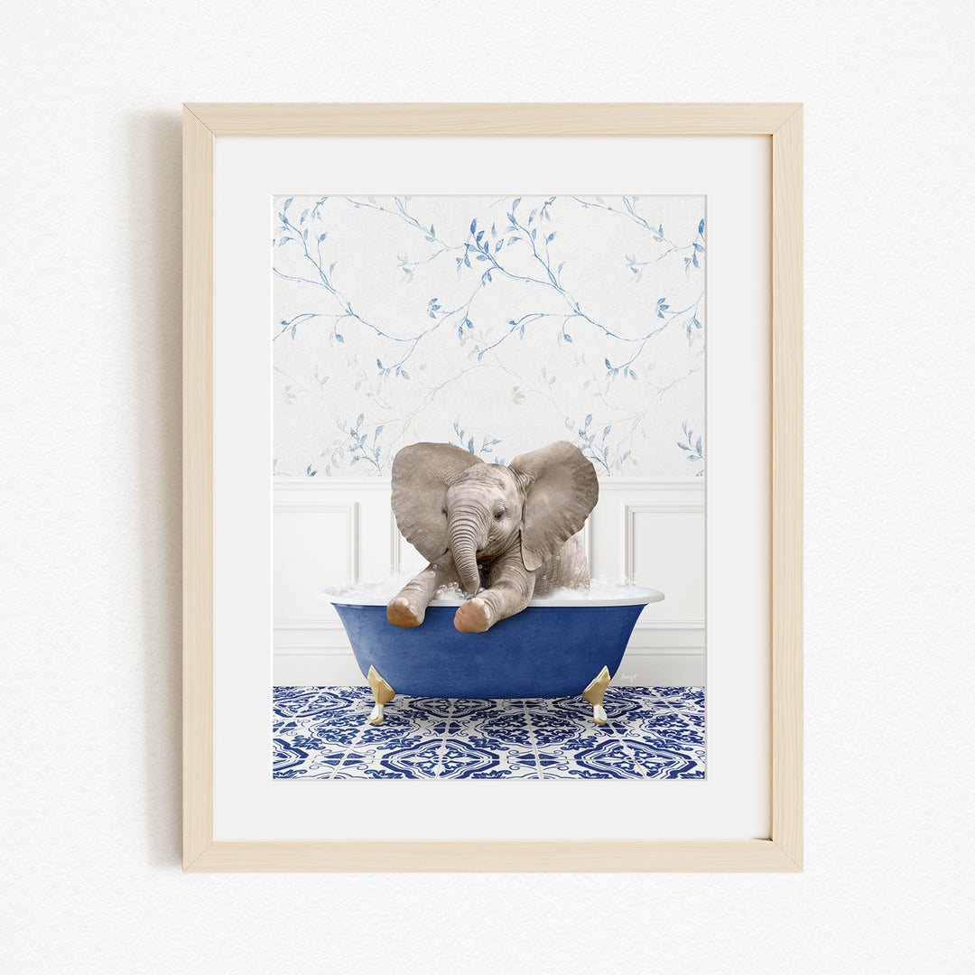 A baby elephant sitting in a blue bathtub, surrounded by a blue and white patterned rug and a white wall with blue floral wallpaper.