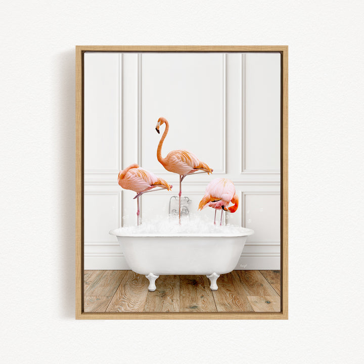 A framed image depicting three flamingos standing in a white bathtub filled with water.