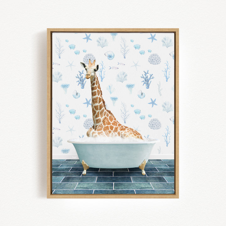 A giraffe sitting in a bathtub filled with water, surrounded by blue and white floral patterns on the wall behind it.