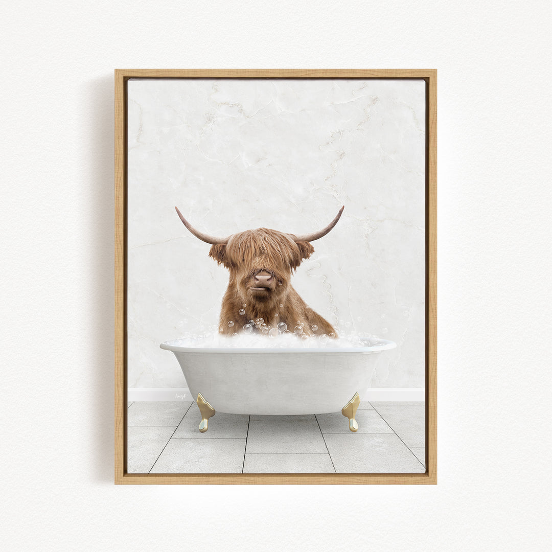 A brown cow with long horns is sitting in a white bathtub filled with bubbles, creating a whimsical and playful scene.