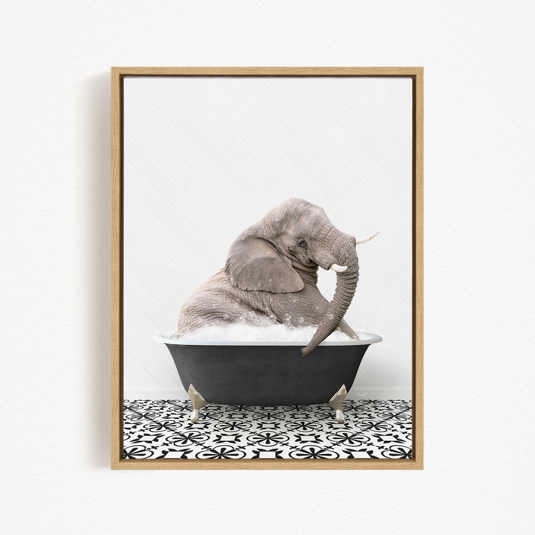 A gray elephant sitting in a black bathtub filled with water, surrounded by a black and white patterned floor.