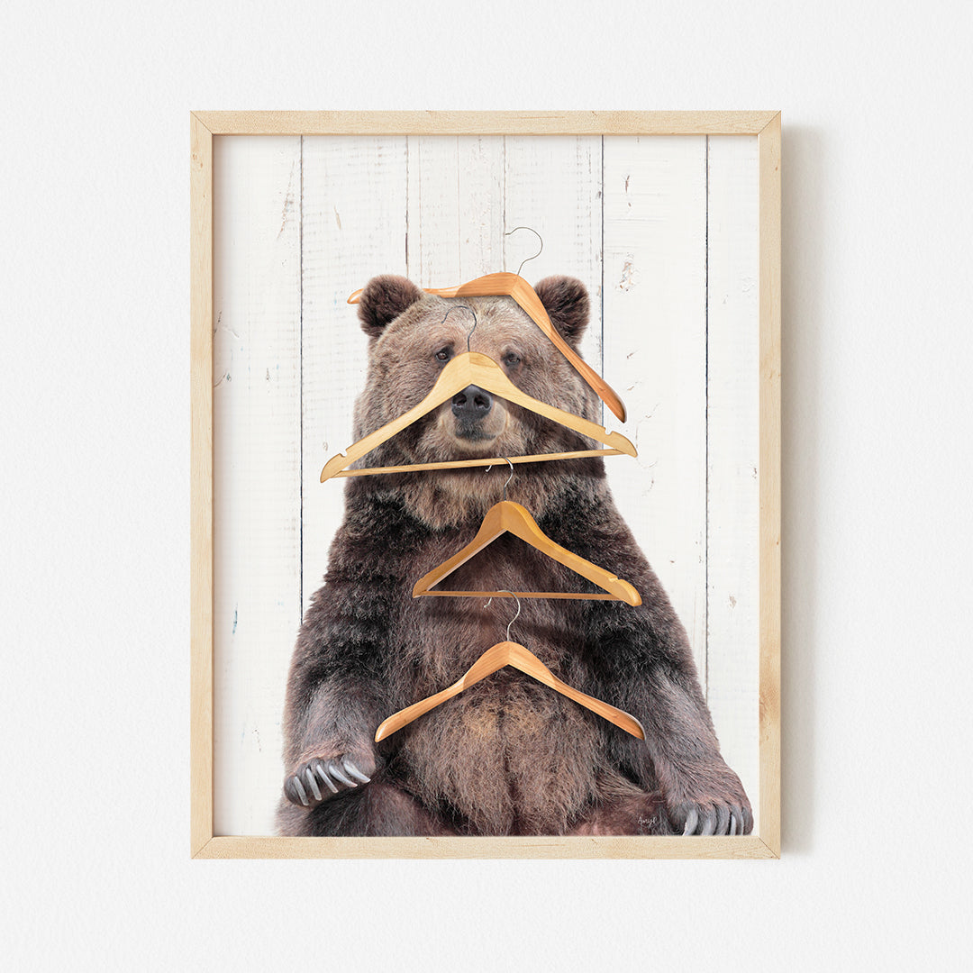 a picture of a bear with clothes hangers on it