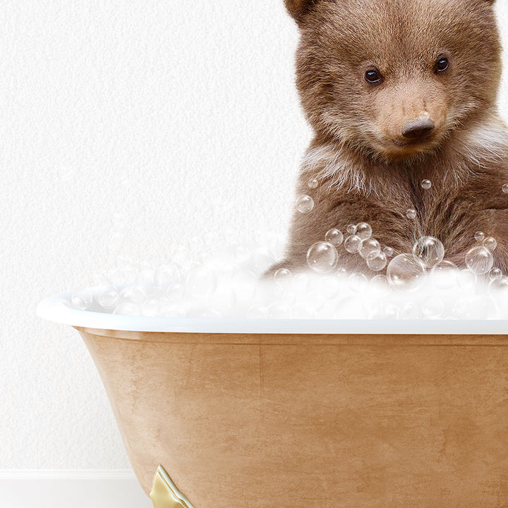 a brown bear sitting in a bath tub filled with bubbles