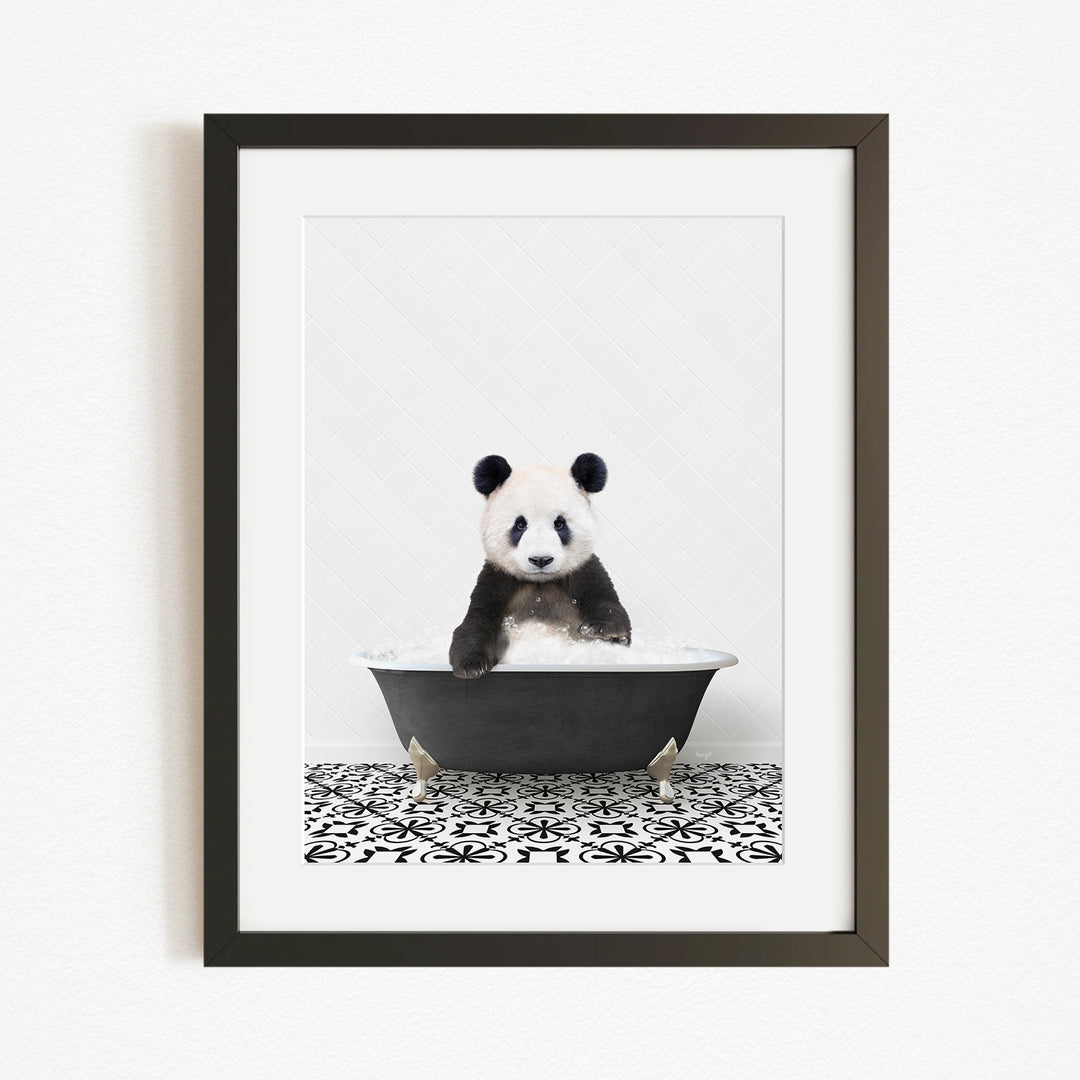 A panda bear sitting in a bathtub, surrounded by a black and white patterned floor.