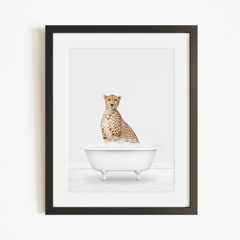 A cheetah sitting in a white bathtub filled with water, looking directly at the camera.