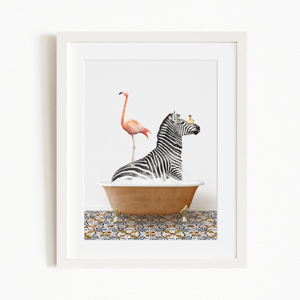 A framed image depicting a zebra sitting in a bathtub with a pink flamingo standing on its back legs.