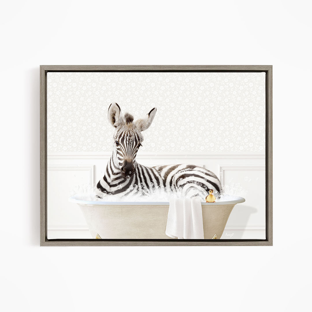 A zebra is sitting in a bathtub filled with water, surrounded by a towel and a rubber duck.