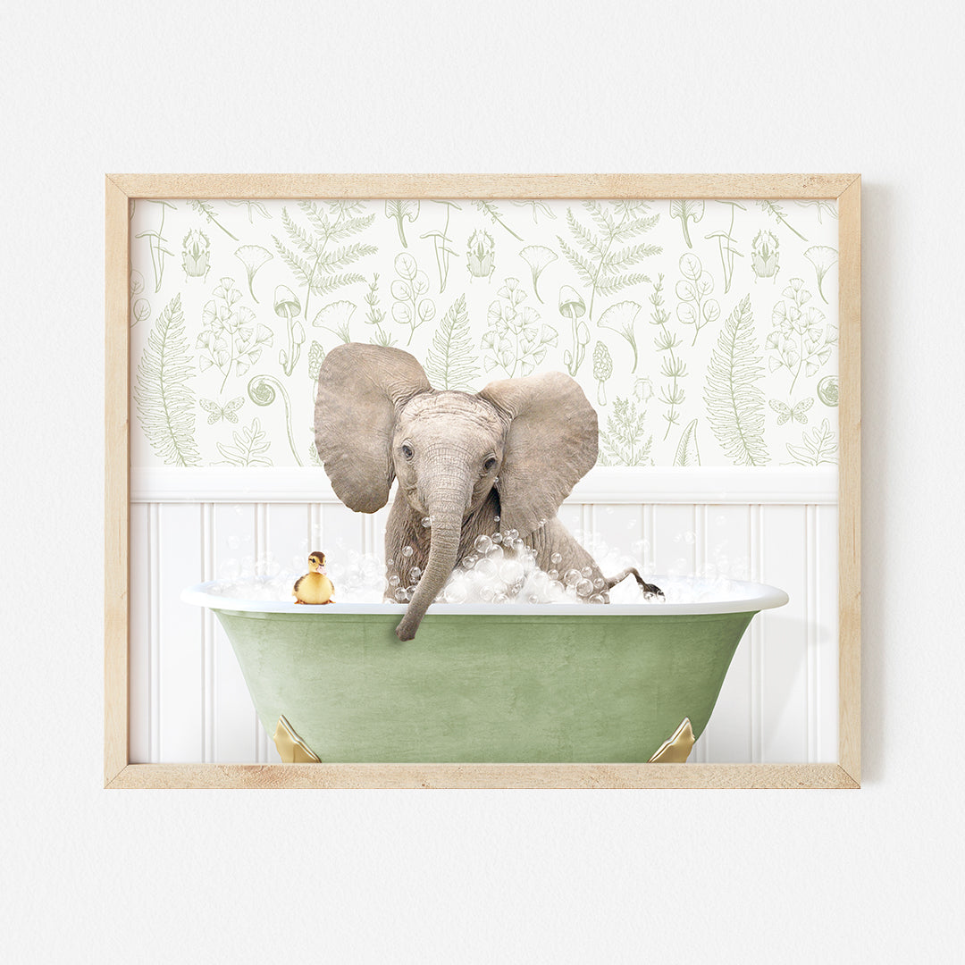 an elephant taking a bath in a green bathtub