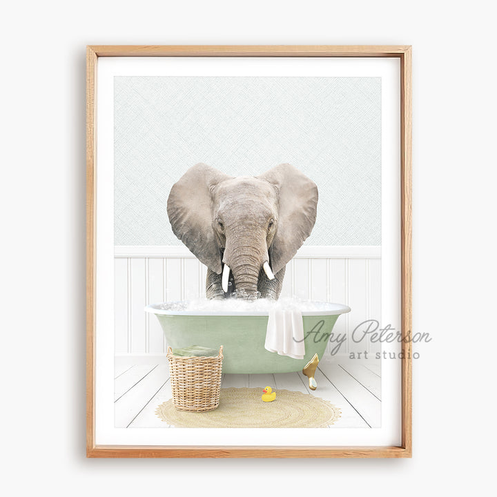 a picture of an elephant taking a bath