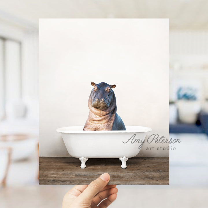 a hippopotamus sitting in a bathtub with a white background