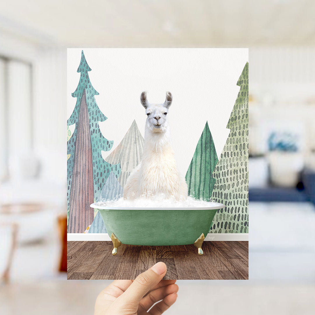 A white llama sitting in a green bathtub, surrounded by a winter landscape with trees and snow.