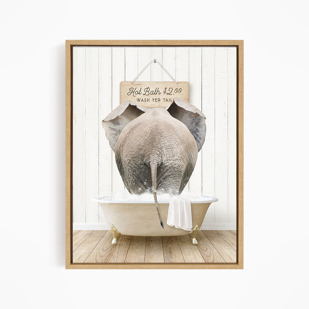 A framed image depicting an elephant sitting in a bathtub, with a sign above it that reads "Hot Bath $2.00 Wash Your Tail".