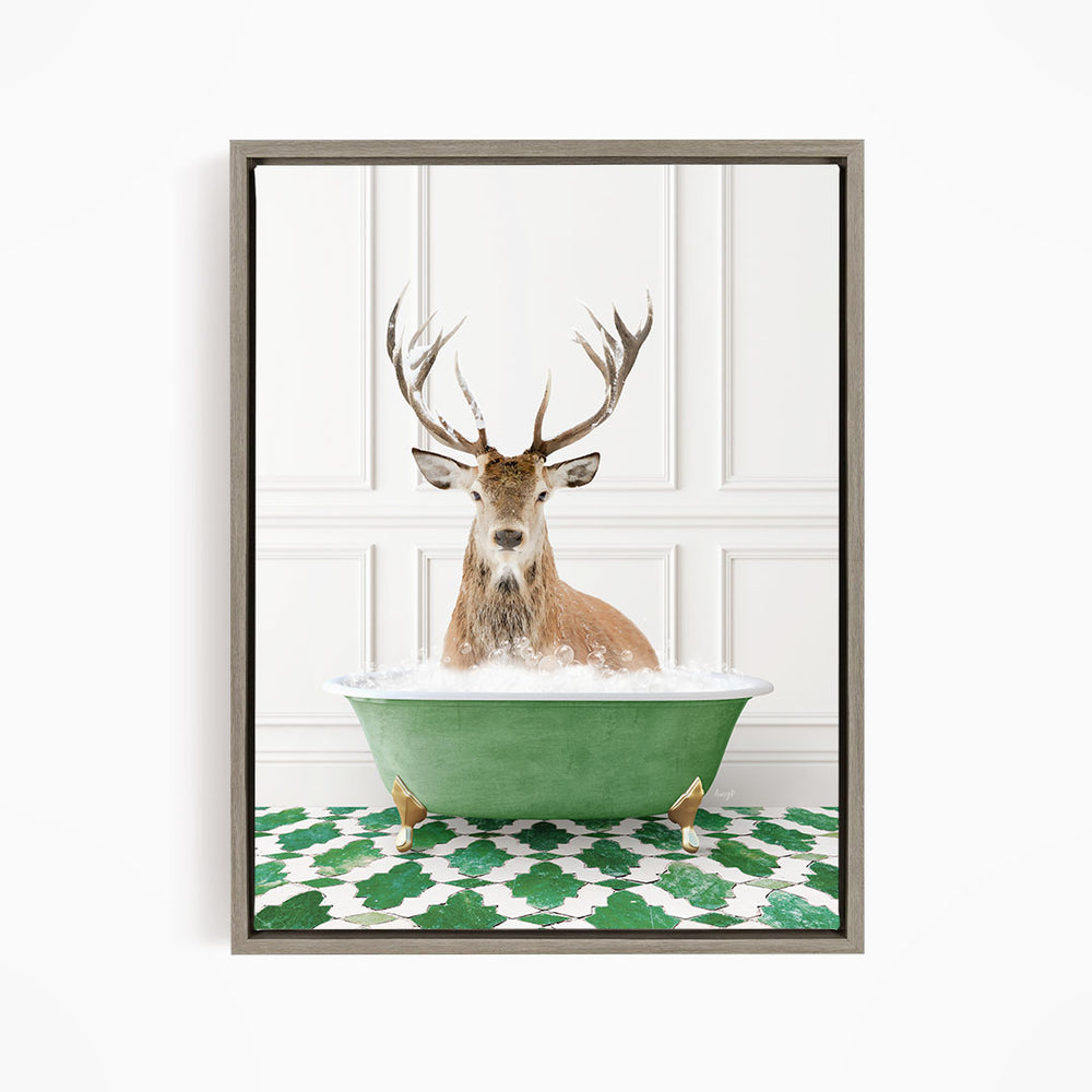 A deer with large antlers is sitting in a green bathtub filled with water, surrounded by a green and white patterned floor.