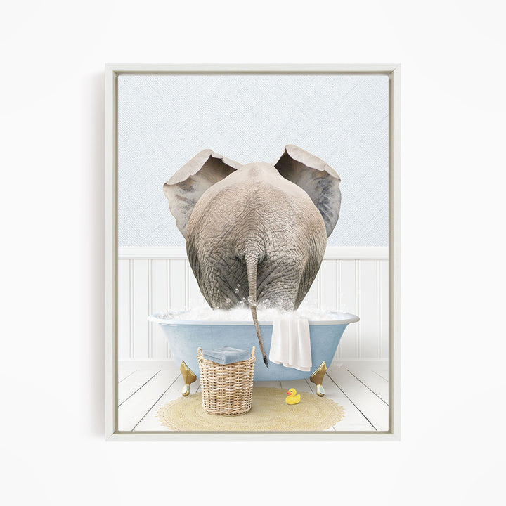 A gray elephant is standing in a blue bathtub filled with water, surrounded by a yellow rubber duck and a basket.