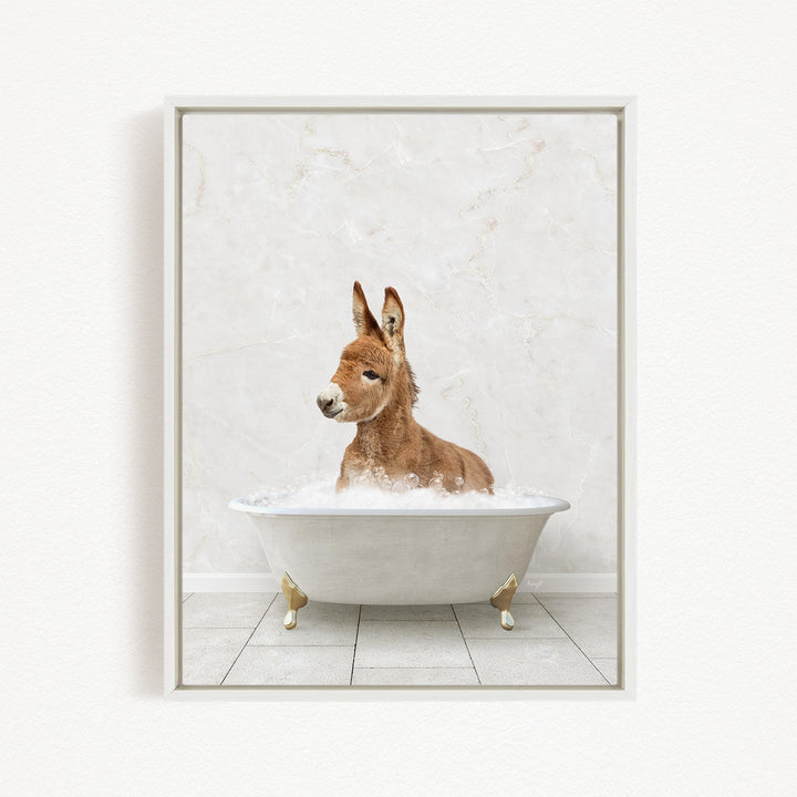 A donkey is sitting in a white bathtub filled with water, creating a whimsical and playful scene.