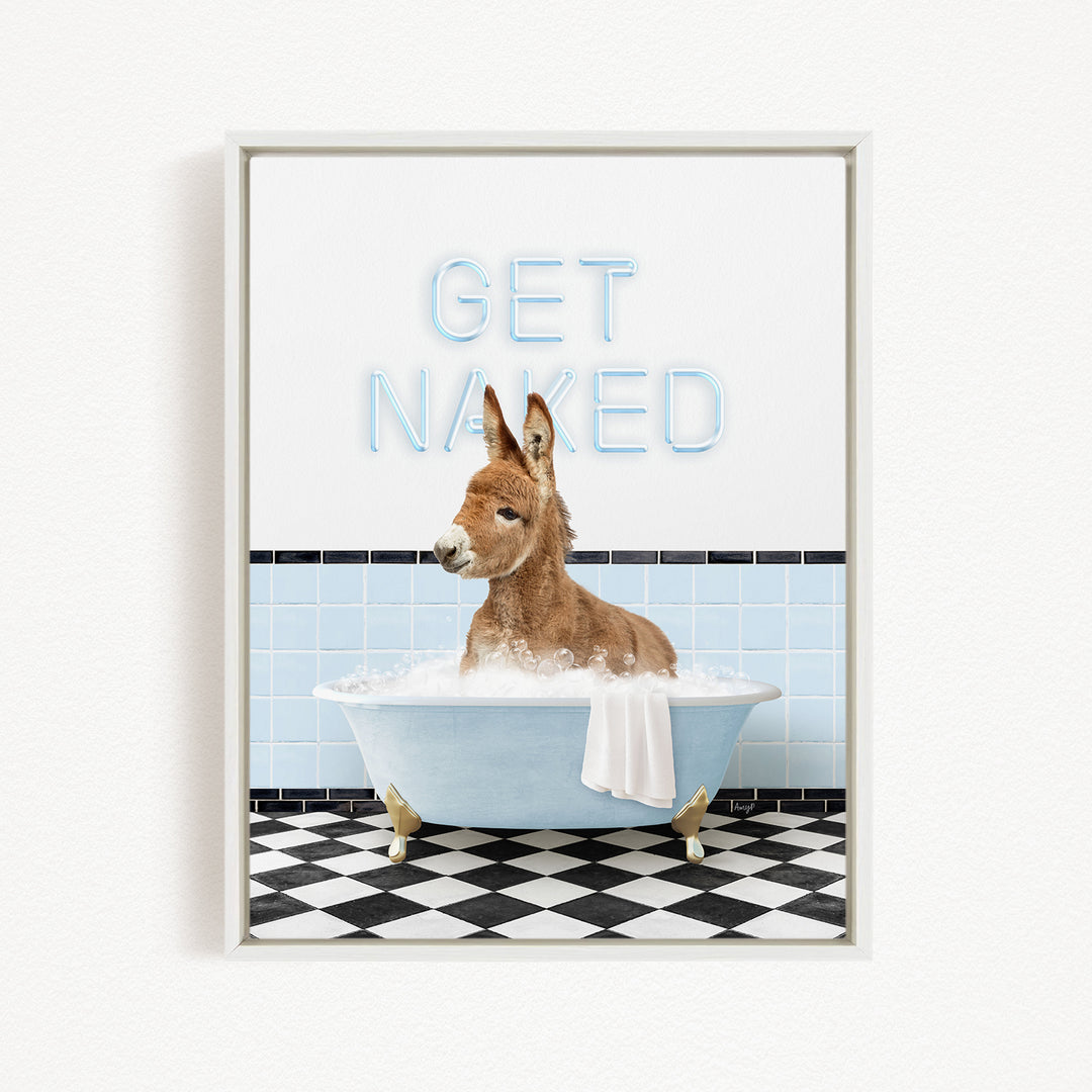A donkey is sitting in a bathtub filled with water, with the words "GET NAKED" written on the wall behind it.
