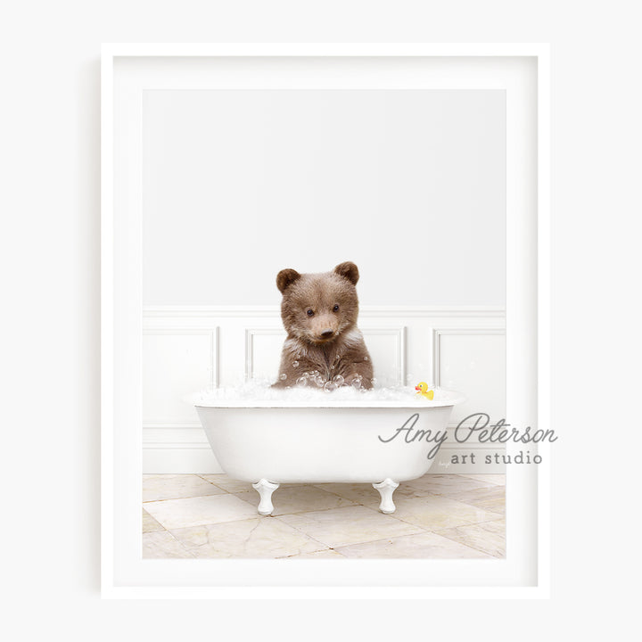 a brown teddy bear sitting in a bath tub