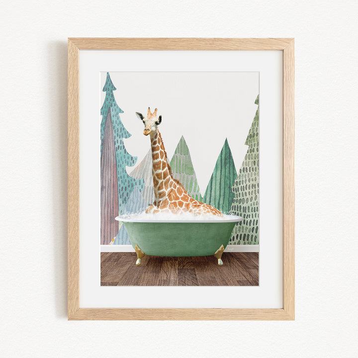 A giraffe sitting in a green bathtub, surrounded by trees and mountains in the background.