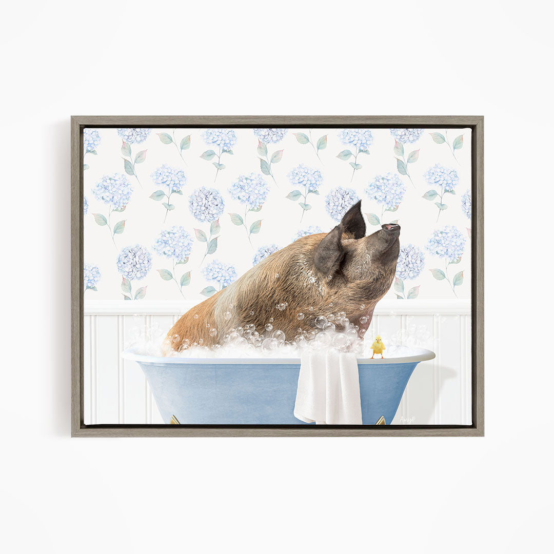 A brown dog is sitting in a blue bathtub filled with bubbles, looking up at the camera with a yellow toy nearby.