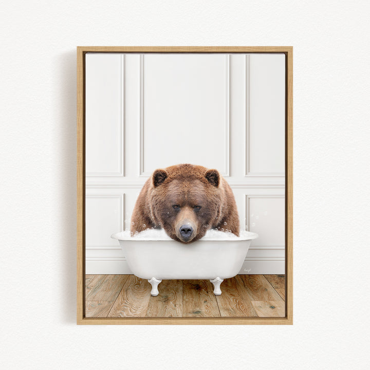 A brown bear sitting in a white bathtub, appearing to be enjoying a relaxing bath.
