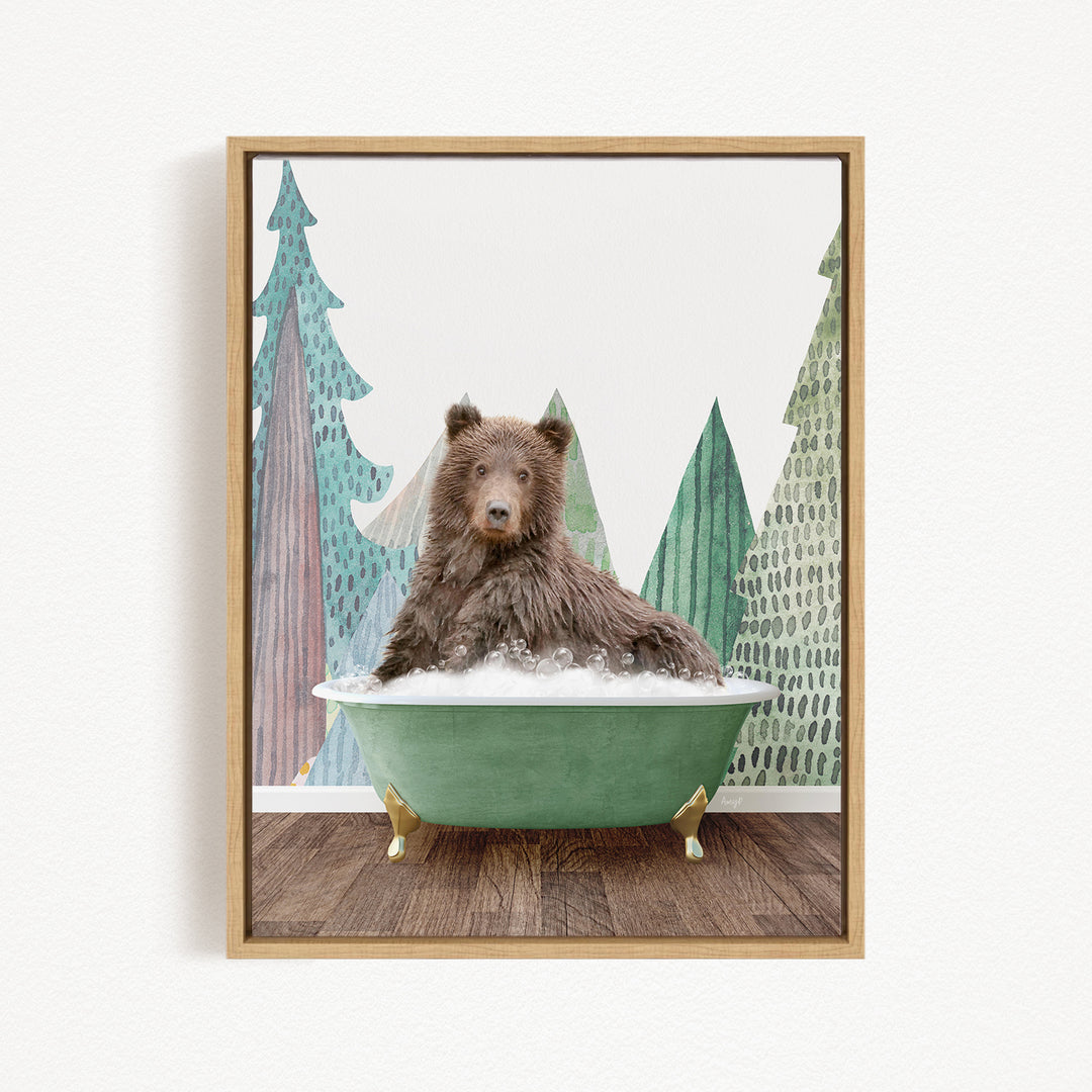 A brown bear is sitting in a green bathtub, surrounded by trees with green and brown foliage.