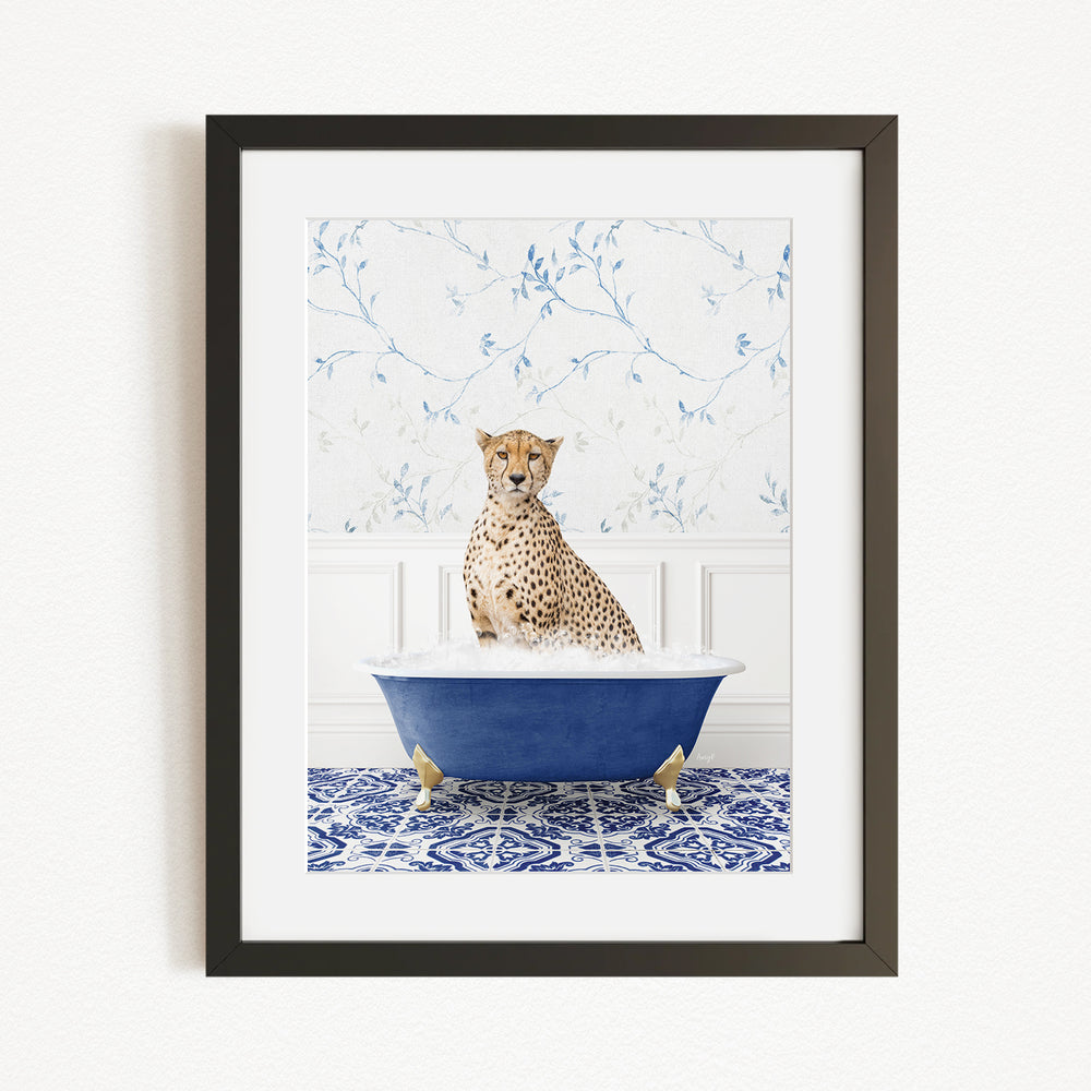 A cheetah sitting in a blue bathtub filled with water, surrounded by a blue and white patterned rug.
