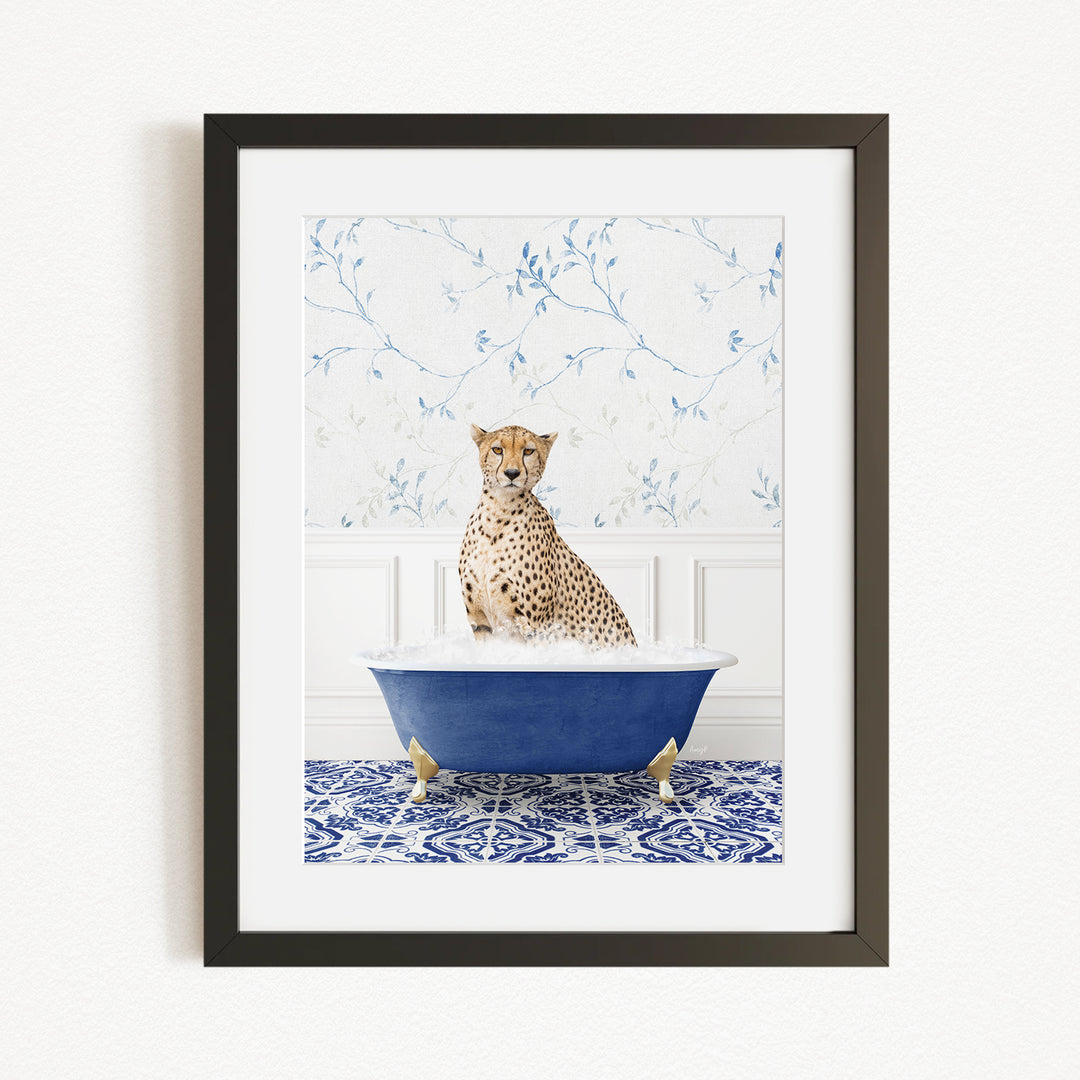 A cheetah sitting in a blue bathtub filled with water, surrounded by a blue and white patterned rug.