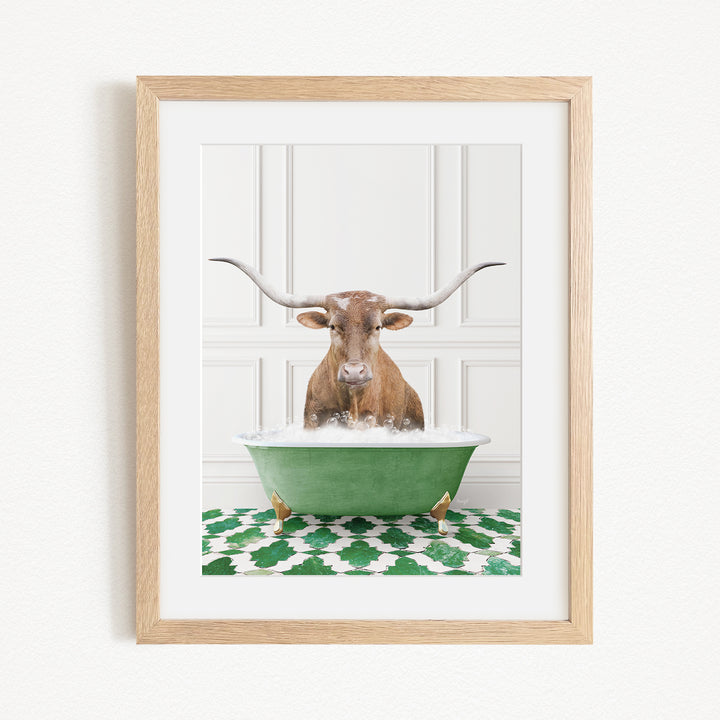 A brown cow with long horns is sitting in a green bathtub filled with water, creating a whimsical and playful scene.