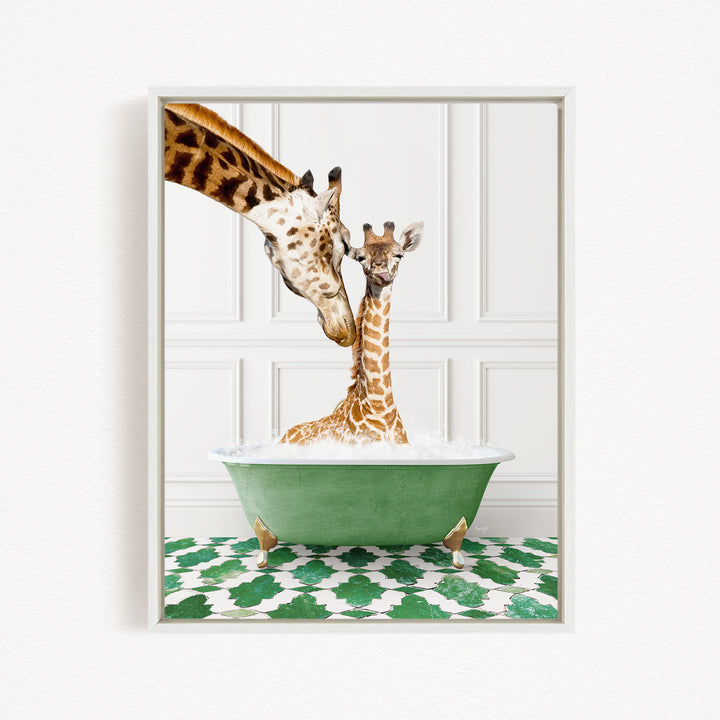 A mother giraffe and her baby giraffe are sitting together in a green bathtub, with the mother gently licking her baby.